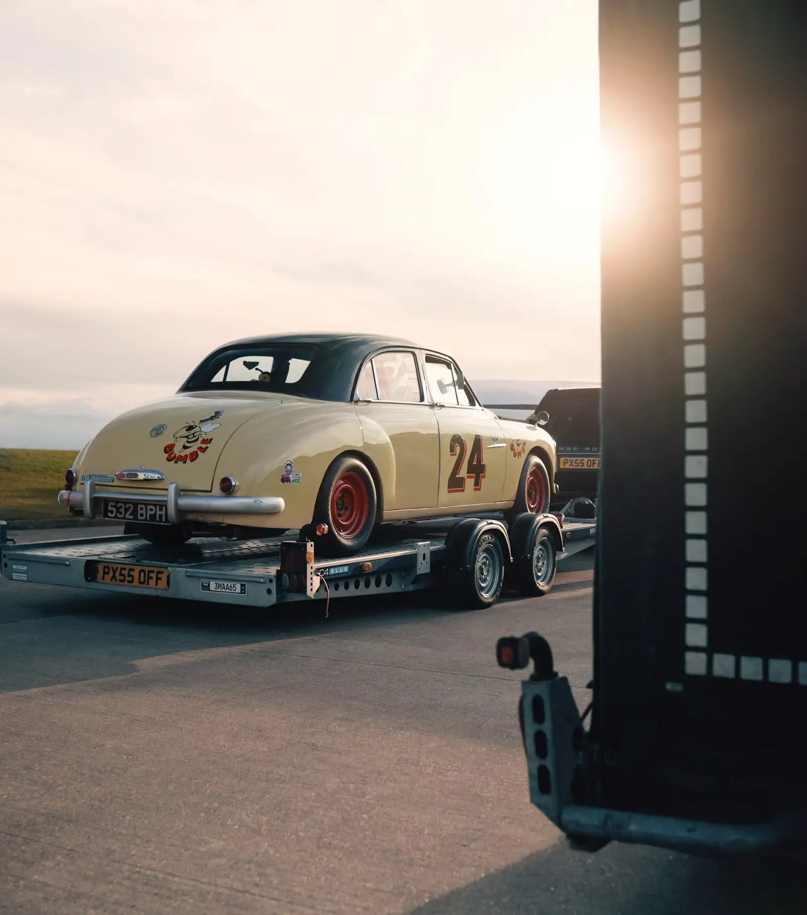 A car loaded onto a flatbed tow truck after being recovered under a signed authority to tow.